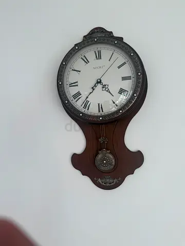 Vintage Wall Pendulum Clock with Ornate Metal Accents