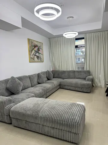 Large L-shaped Grey Corduroy Sofa with Ottoman - Good Condition