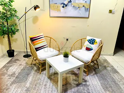 Rattan Two-Seat Lounge Set with Cushions and Coffee Table