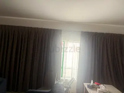 Full-length blackout curtains - dark grey, ready to hang.