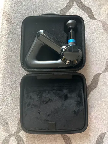 Handheld percussion massage gun with travel case - lightly used