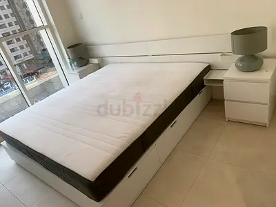 White storage platform bed with 6 big storage boxes and headboard, includes 2 bedside tables la