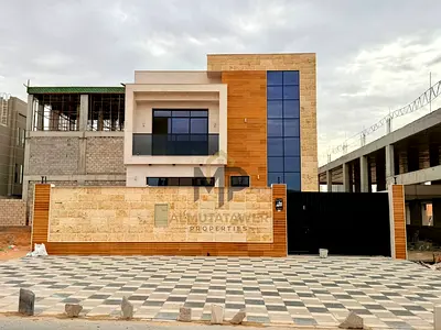 Villa for sale, including registration and ownership fees, near all services, close to Sheikh Mohammed Bin Zayed Road on a main street, prime location