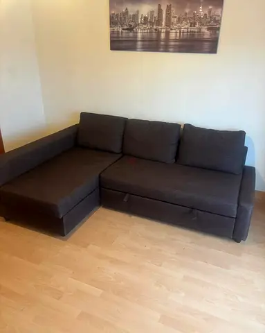 L-shaped dark grey fabric sofa with chaise (convertible)
