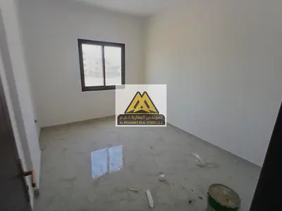 First-tenant one-bedroom apartment with living room in Al Alia, Ajman. Split AC, spacious layout, f
