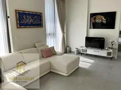Two-bedroom apartment with a living room, fully furnished, for rent in Aljada, Sharjah, with a moder