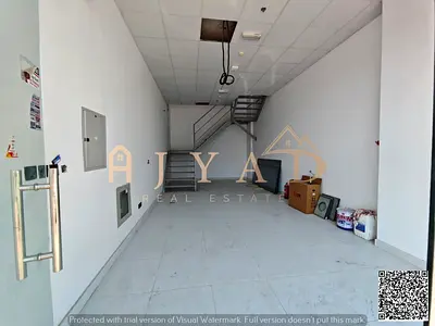 Annual commercial shop for rent in Muwaihat 3 on Academy Street. The property features a spacious l