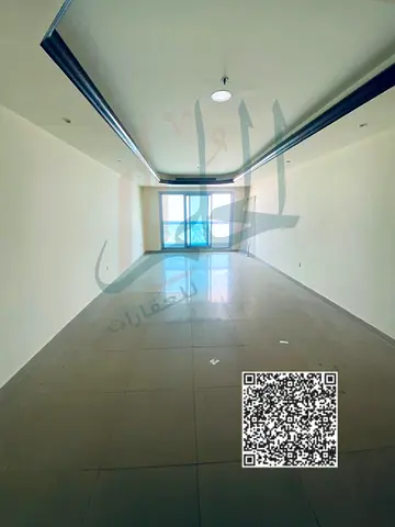 Apartment for sale, freehold ownership, in Ajman Corniche Tower, large area and immediate return on investment.