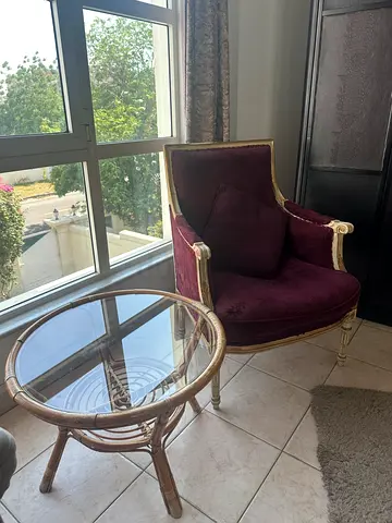 Armchair with glass side table