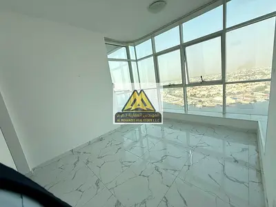 A spacious 2-bedroom apartment with a living room for annual rent in Al Waha Towers – Ajman, featur
