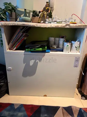 Compact white storage cabinet with open shelf — good condition