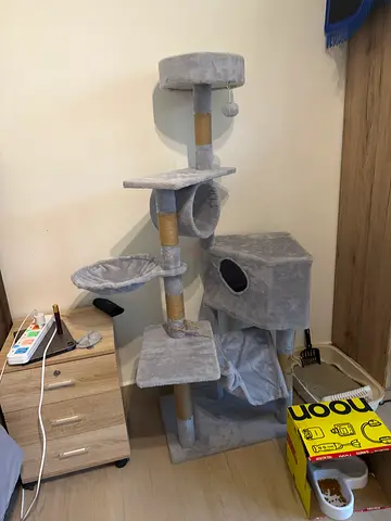 Gray multi-level cat tree with condo and scratching posts