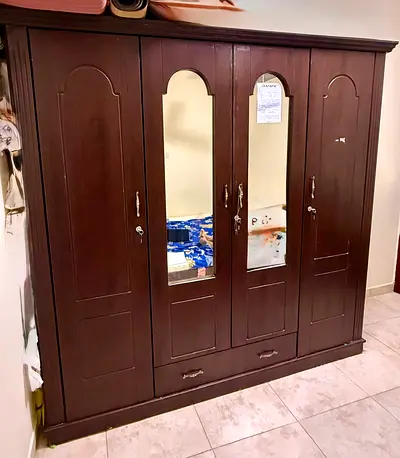 Dark wood 4-door wardrobe with mirrors and storage drawers