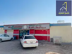 Shop and workers' accommodation for sale in Al Sajaa area with a 10% return for investment