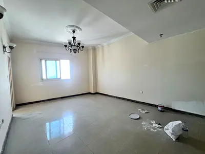 Gym, swimming pool, kids' area, two bedrooms and a living room with a large balcony, city view in Al Taawun