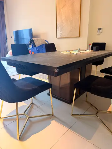 Modern black dining table with 6 velvet chairs