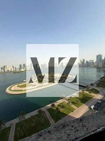 For rent: an apartment in Khaled Tower, Sharjah Corniche, 11th floor, front-facing with a direct view of the lake. It consists of two bedrooms, includ
