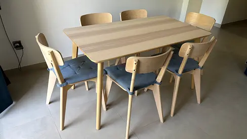 Light wood dining table with 6 matching chairs