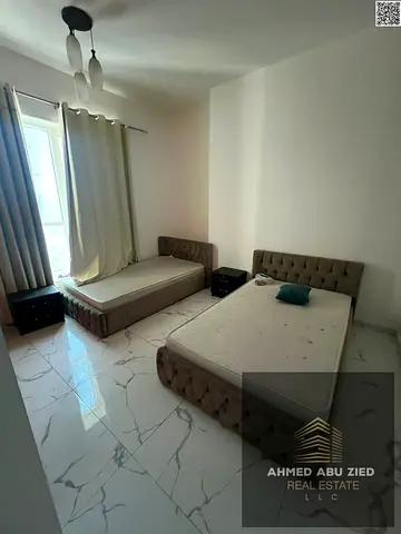 Two bedrooms and a living room in Al Rashidiya Oasis Towers 1 – Gym and swimming pool, parking, very large spaces