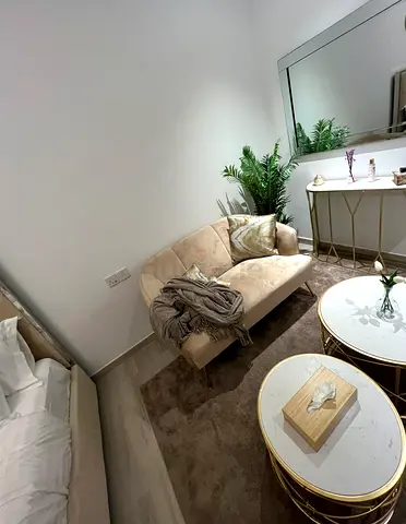 Cozy Beige Sofa with Gold Accent Coffee Tables and console table- Like New. 500 aed for all .