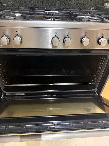 Stainless steel gas range with oven - good working condition