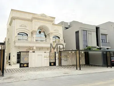 A unique opportunity to own a two-story villa in one of Ajman's most prestigious areas, complete with a rooftop terrace, internal elevator, and direct