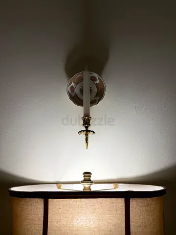 Pair of vintage brass wall sconces with porcelain backplates
