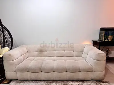 Light Beige Tufted Three-Seater Sofa - Comfortable Modern Design