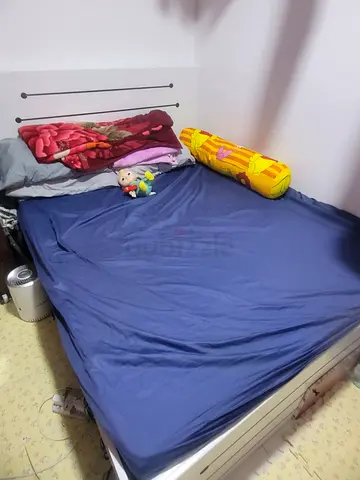 Queen size bed with mattress used for less than a year
