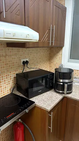 Used Black Microwave and Air Fryer - Good Working Condition