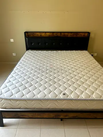 Queen size mattress with wooden bed frame and headboard - excellent condition