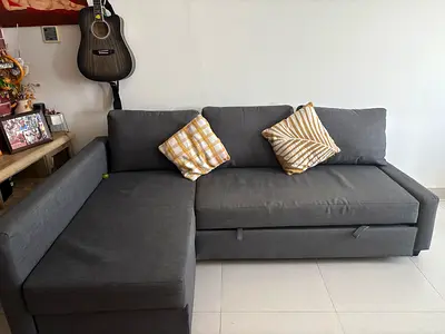 IKEA sofa bed. Dark Grey L-Shaped Sofa Bed with Storage - Good Condition barely used.