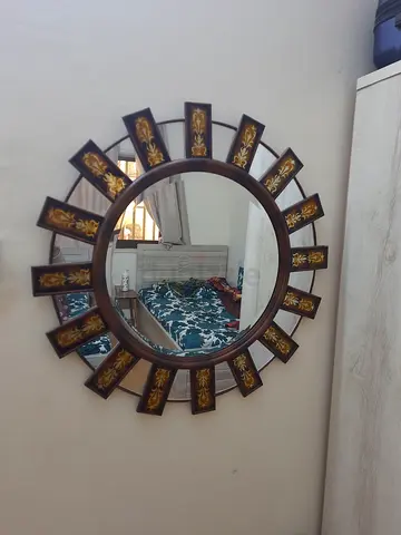 Decorative Sunburst Wall Mirror with Ornate Accents