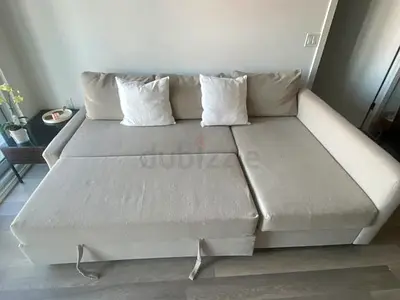 Beige L-shaped Sofa Bed with Pull-Out Section — Good Condition