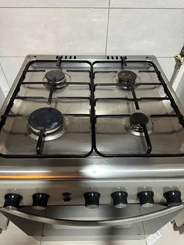 Used stainless steel 4-burner gas cooker with oven - good condition