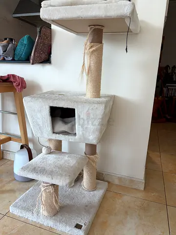 Used beige multi-level cat tree with scratching posts and condo. Needs new cords.