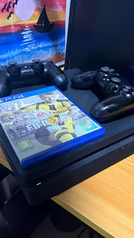 PS4 console with two controllers + FIFA 17