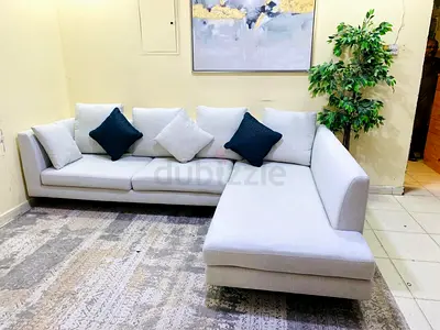 Light grey L-shaped sectional sofa with chaise - good condition