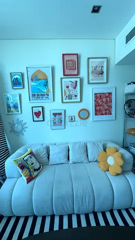 Light Beige Curved Sofa with Decorative Cushions - Very Good Condition