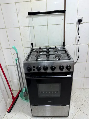Stainless Steel 4-Burner Gas Cooker with Oven - Good Working Condition
