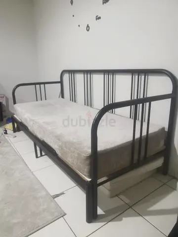 Sofa cum bed with cushions