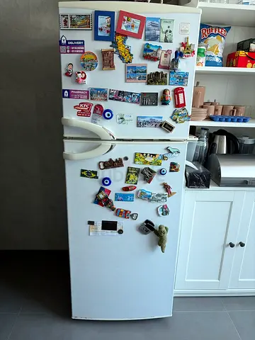 White Double-Door Fridge Freezer with Collection of Magnets - Good Working Condition