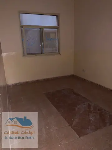 For annual rent: One bedroom and living room with two bathrooms and a balcony, ground floor, in Al-