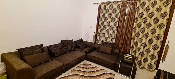 L shaped Sofa with Carpet and Curtain
