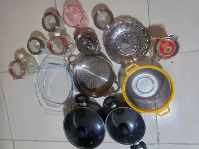 Mixed kitchen strainers, lids and glass jars - great condition
