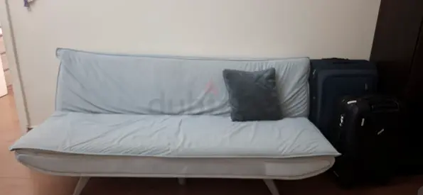Light blue fabric sofa bed / futon in good used condition. Sofa cum bed