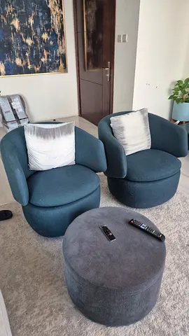 Pair of modern blue swivel lounge chairs with ottoman - good condition
