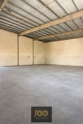 8000 sqft warehouse UAQ mezzanine 100KW AED 310K two main roads offices ready