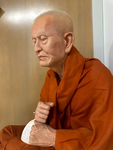 Lifelike Seated Monk Statue - Realistic Buddhist Figure with Prayer Beads