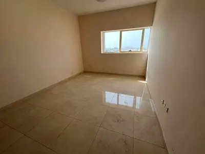 Full open view with free parking for a stunning 2-bedroom master apartment with balcony in one of the finest towers in Sharjah.